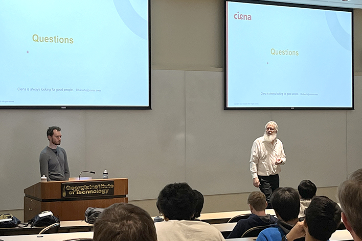 Kim Roberts and a colleague giving a lecture at Georgia Tech