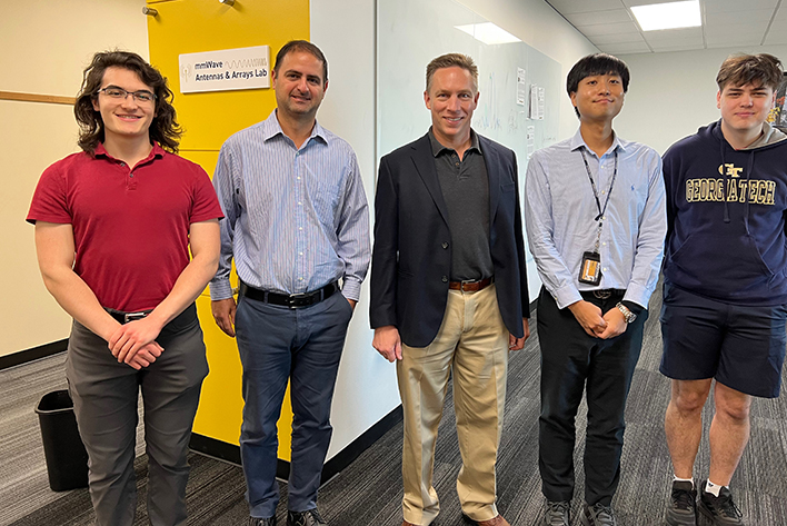 Daniel Sievenpiper posing with Nima Ghalichechian and a group of Georgia Tech students